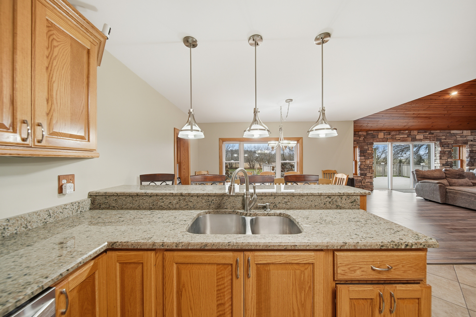 7231 South Lost Nation Road Dixon, IL 61021 - Photo 17 of 39 a kitchen with granite countertop a sink a counter top space and cabinets