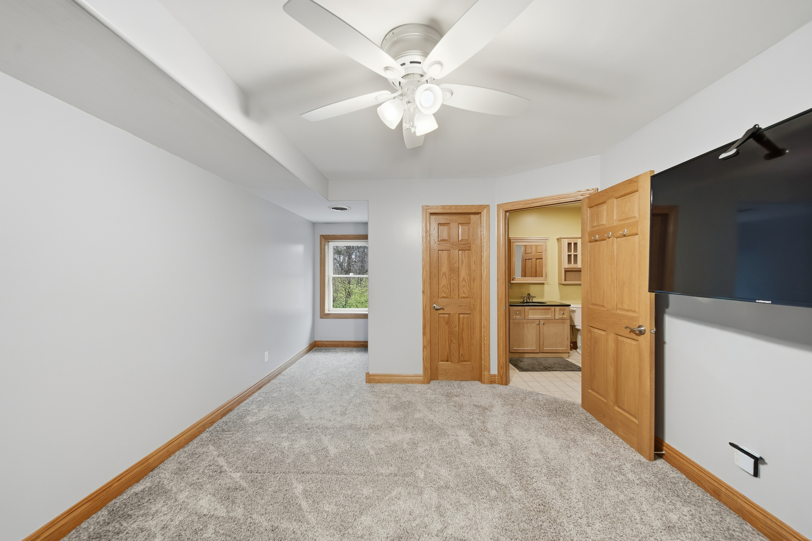 7231 South Lost Nation Road Dixon, IL 61021 - Photo 21 of 39 wooden floor in an empty room with a kitchen