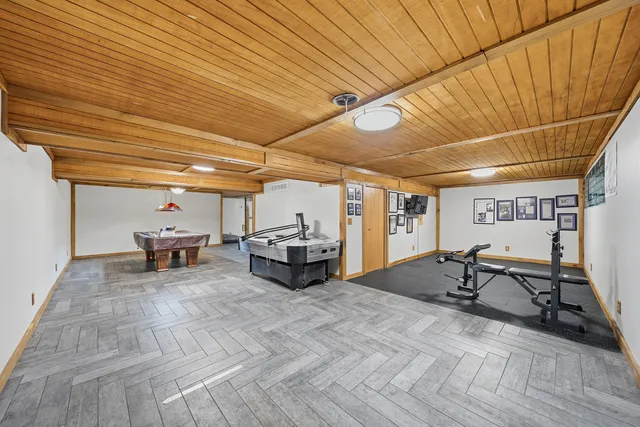 a bathroom with a sink a toilet and shower curtain