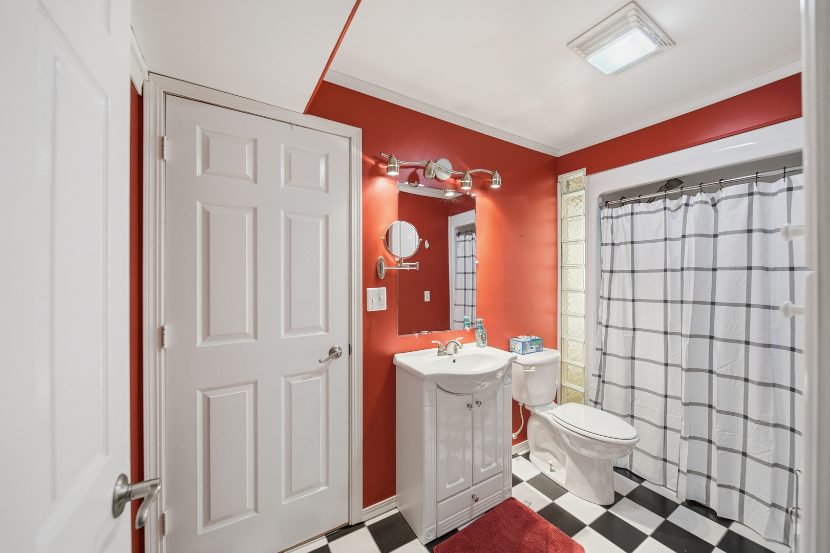 7231 South Lost Nation Road Dixon, IL 61021 - Photo 27 of 39 a bathroom with a sink a toilet and shower curtain