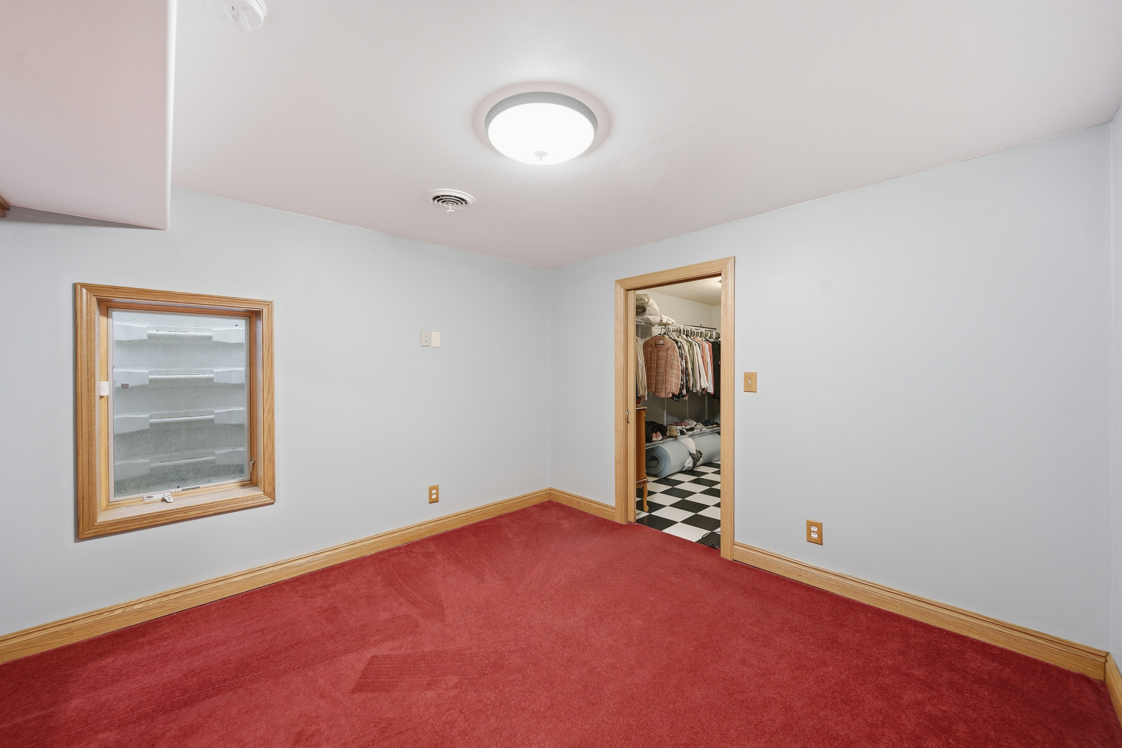 7231 South Lost Nation Road Dixon, IL 61021 - Photo 28 of 39 an empty room with windows and closet