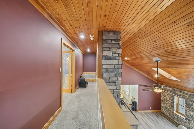 a bathroom with a tub a sink and a large mirror