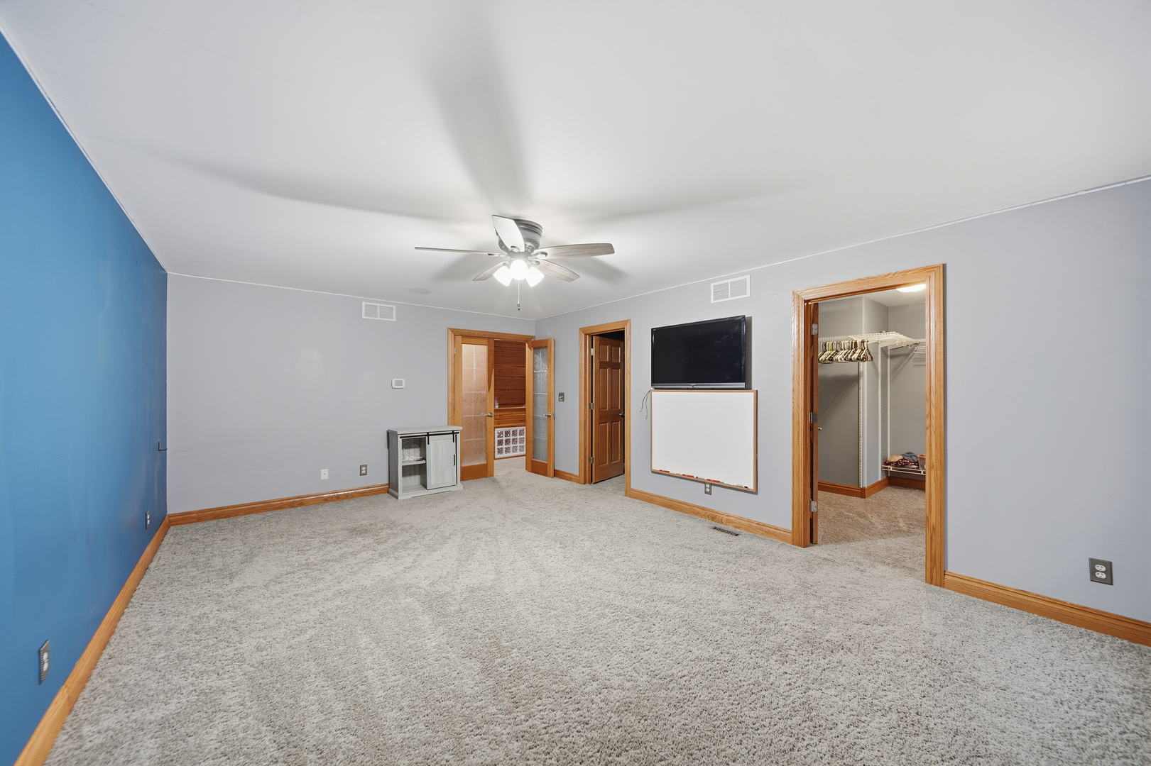 7231 South Lost Nation Road Dixon, IL 61021 - Photo 34 of 39 an empty room with chandelier fan and windows