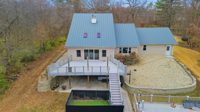 a aerial view of a house with roof deck