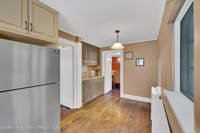 a kitchen with stainless steel appliances a refrigerator and a stove