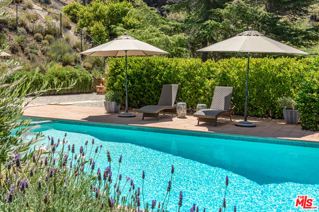 1045 Cold Canyon Road Calabasas, CA 91302 - Photo 23 of 51 a garden view with a seating space