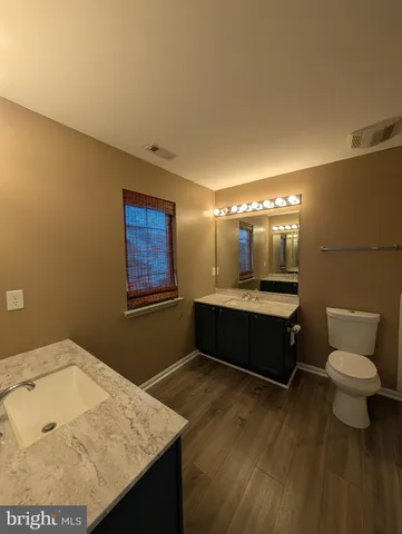 a bathroom with a toilet a sink and bathtub