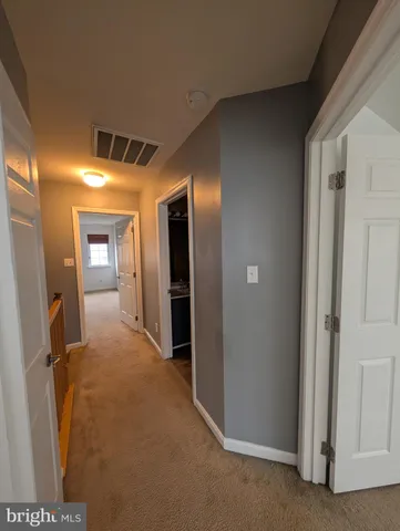 a view of hallway with stairs