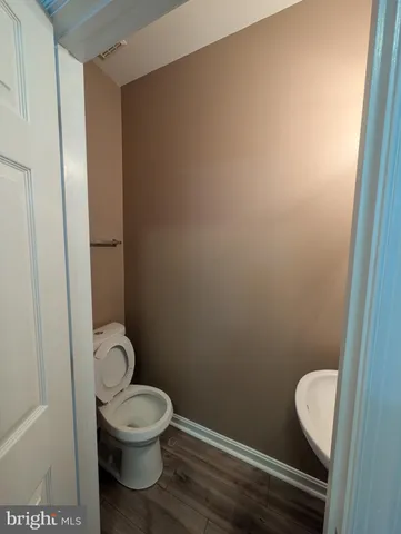 a bathroom with a toilet and a sink