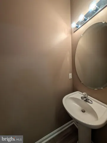 a bathroom with a sink and mirror