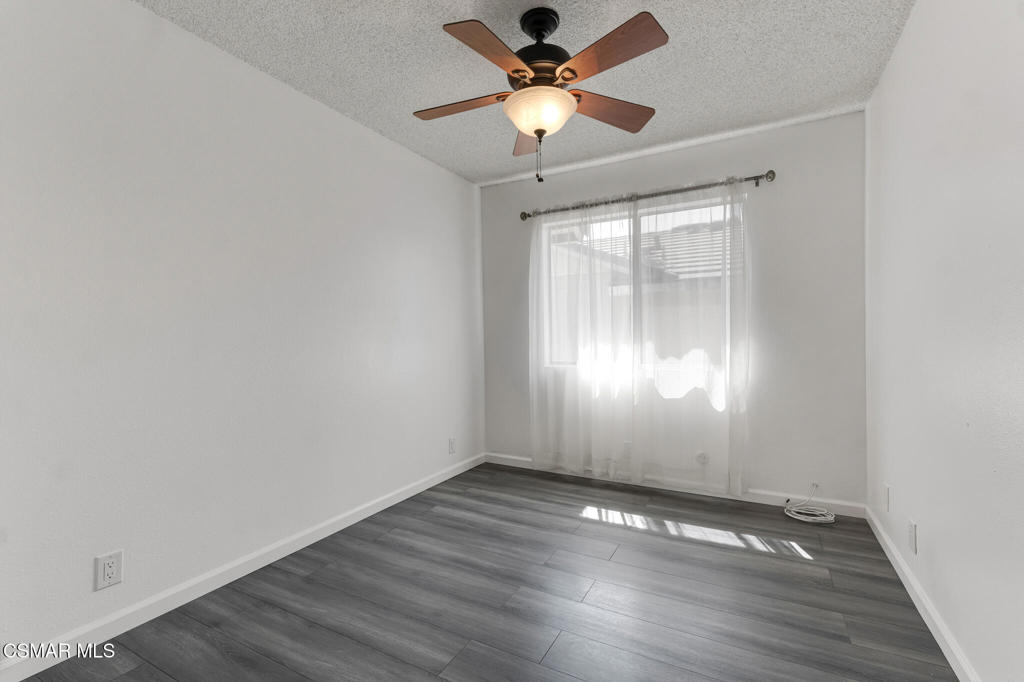 1912 Heywood Street, Unit D Simi Valley, CA 93065 - Photo 17 of 40 an empty room with wooden floor and windows