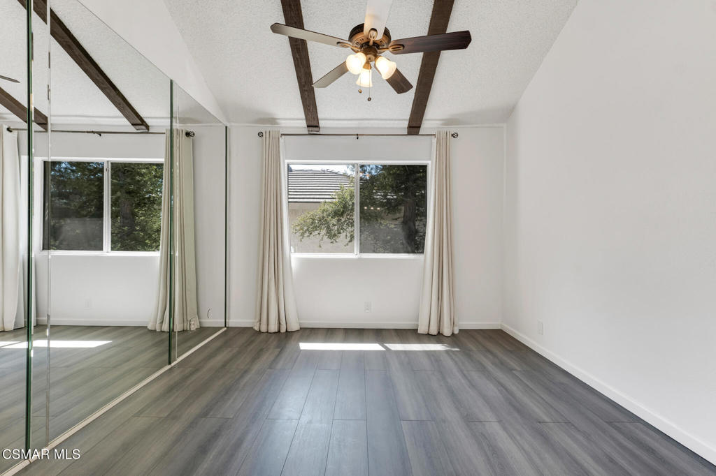 1912 Heywood Street, Unit D Simi Valley, CA 93065 - Photo 18 of 40 an empty room with wooden floor fan and windows