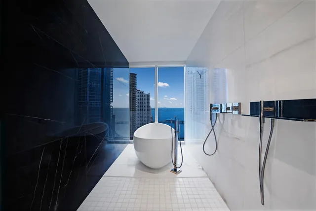 a view of a balcony with furniture and wooden floor