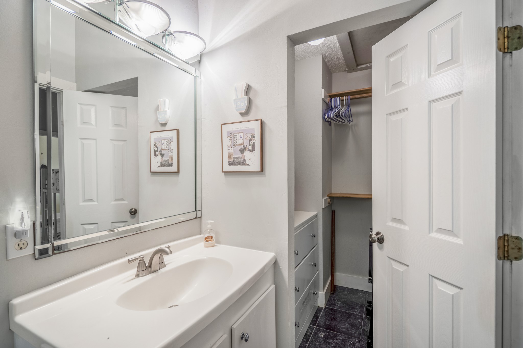 22547 Bayview Circle Point Blank, TX 77364 - Photo 22 of 46 a bathroom with double vanity sink and a mirror