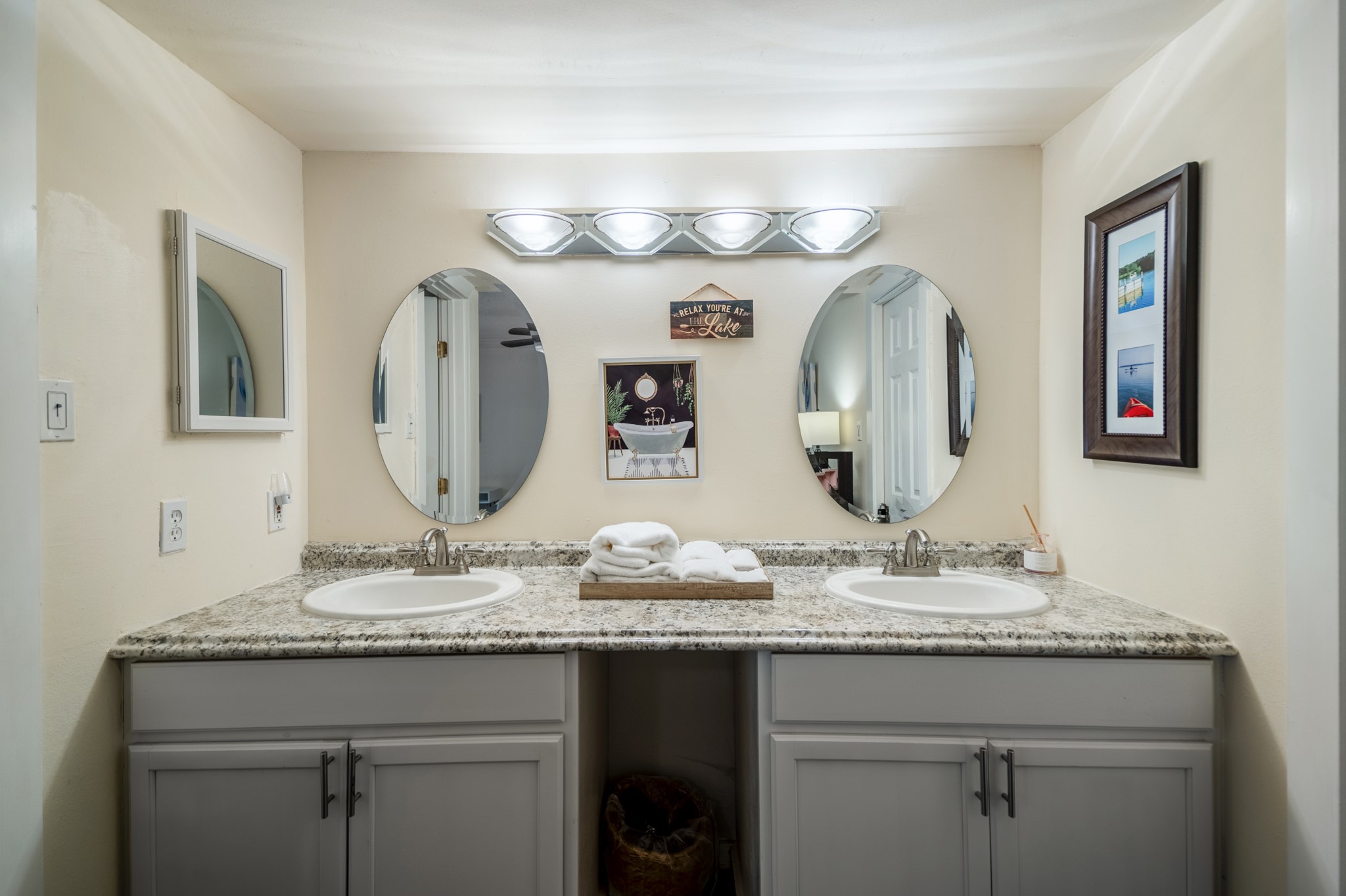 22547 Bayview Circle Point Blank, TX 77364 - Photo 26 of 46 a bathroom with a granite countertop double vanity sinks and a mirror