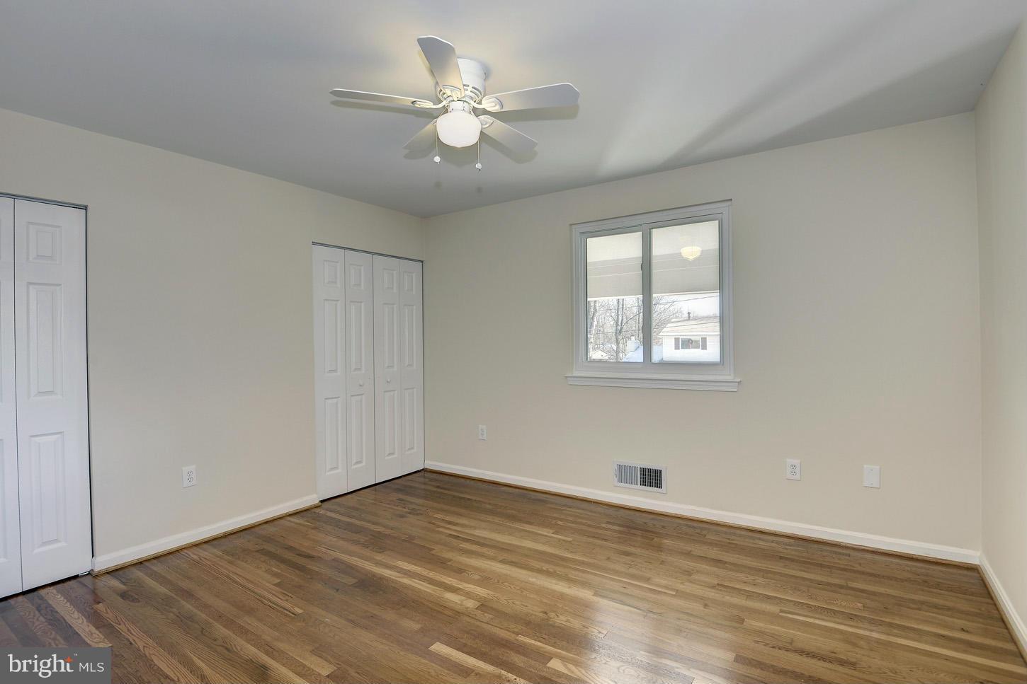 5508 Margate Street Springfield, VA 22151 - Photo 16 of 27 a view of empty room with wooden floor and fan