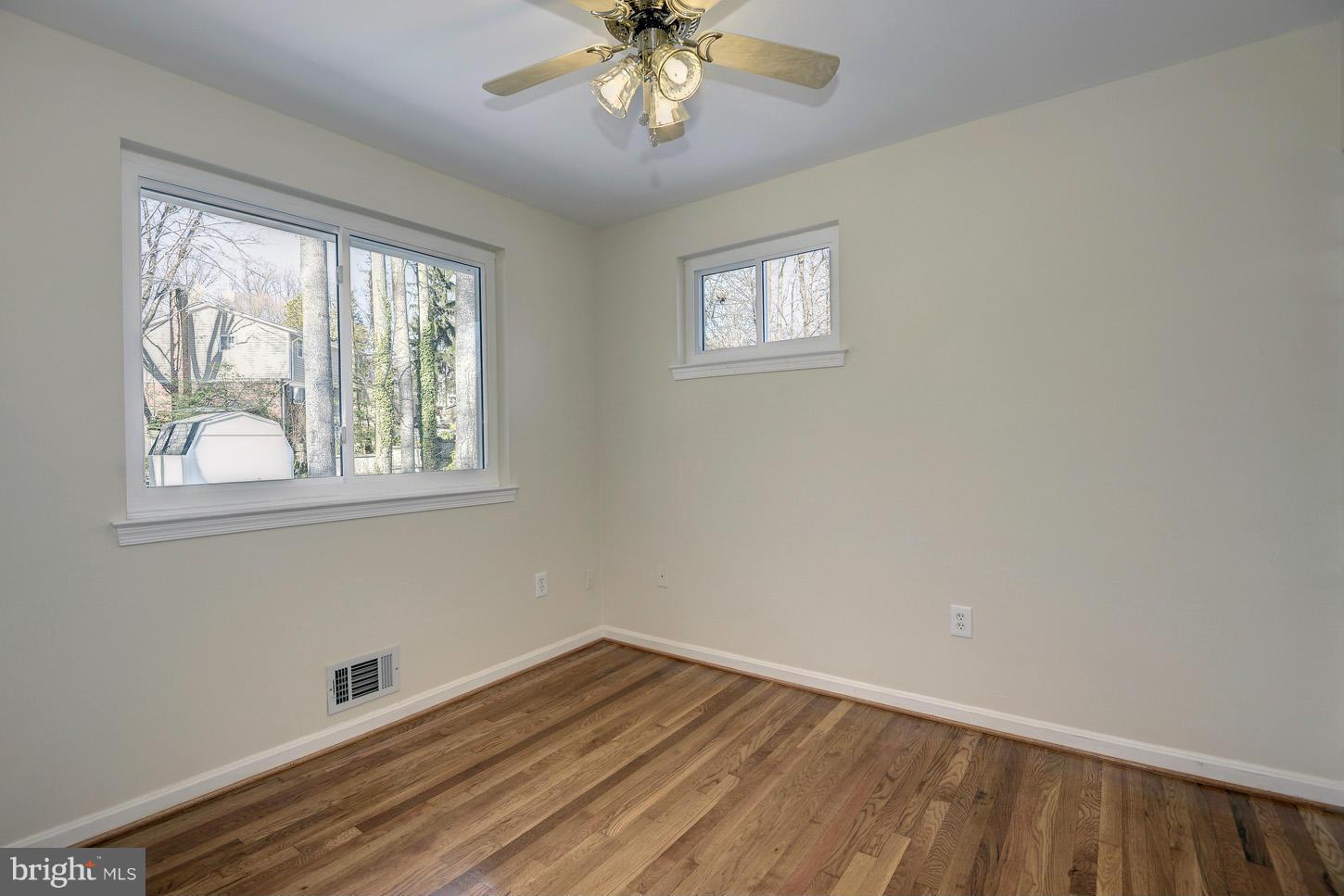 5508 Margate Street Springfield, VA 22151 - Photo 18 of 27 a view of an empty room with wooden floor and a window