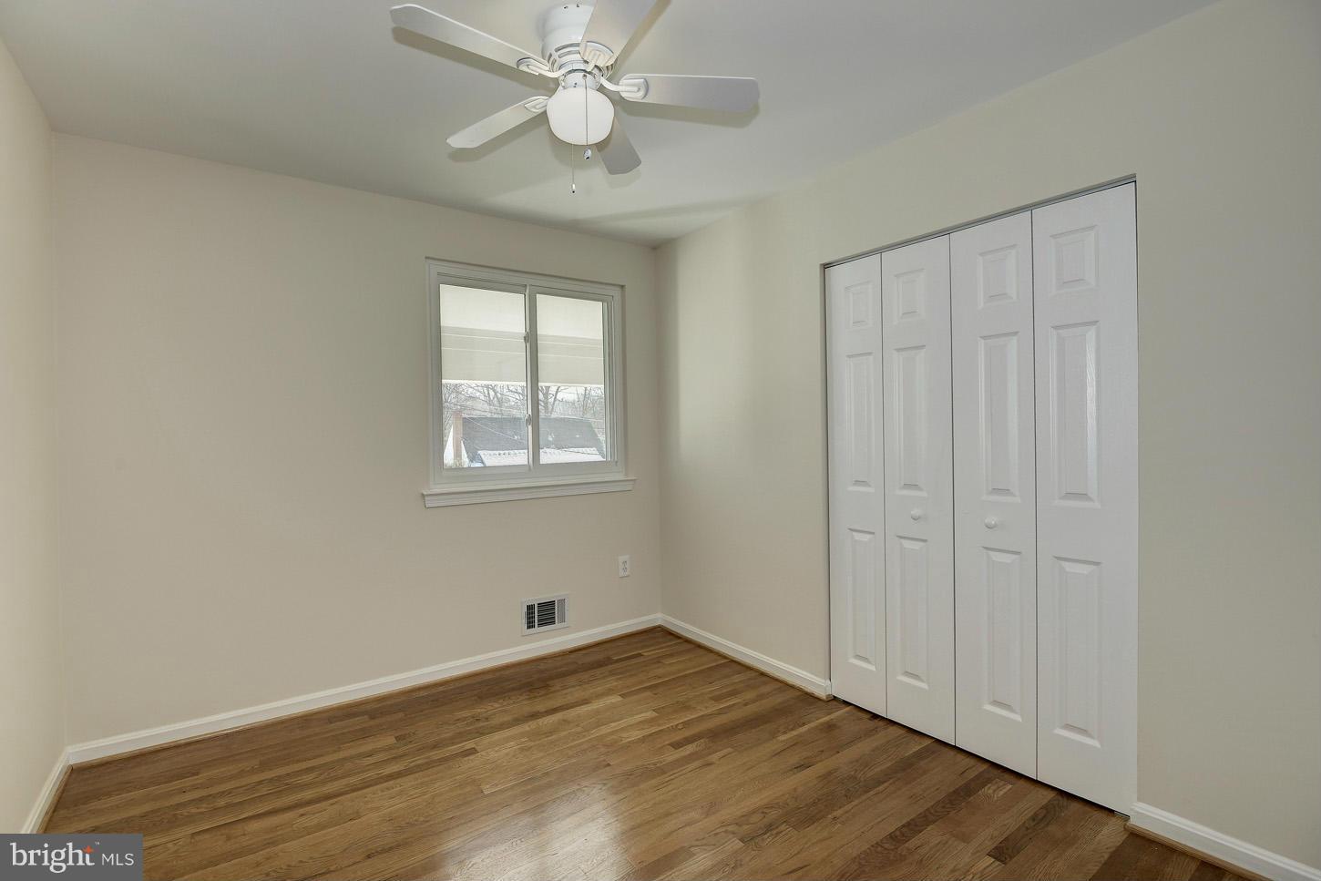 5508 Margate Street Springfield, VA 22151 - Photo 19 of 27 a view of an empty room with wooden floor and a window
