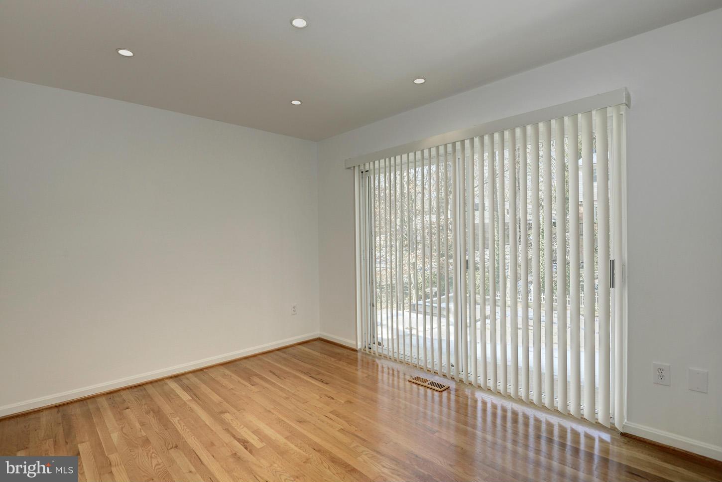 5508 Margate Street Springfield, VA 22151 - Photo 22 of 27 a view of an empty room with wooden floor and a window