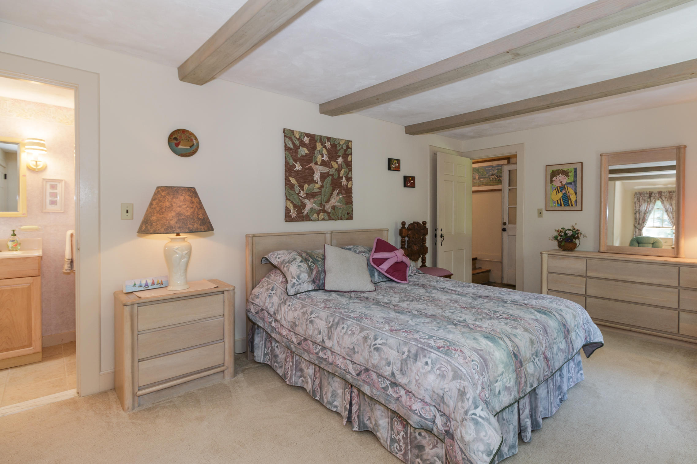 75 Harbor Bluff Road Hyannis, MA 02601 - Photo 12 of 31 a bedroom with a bed and a lamp on dresser