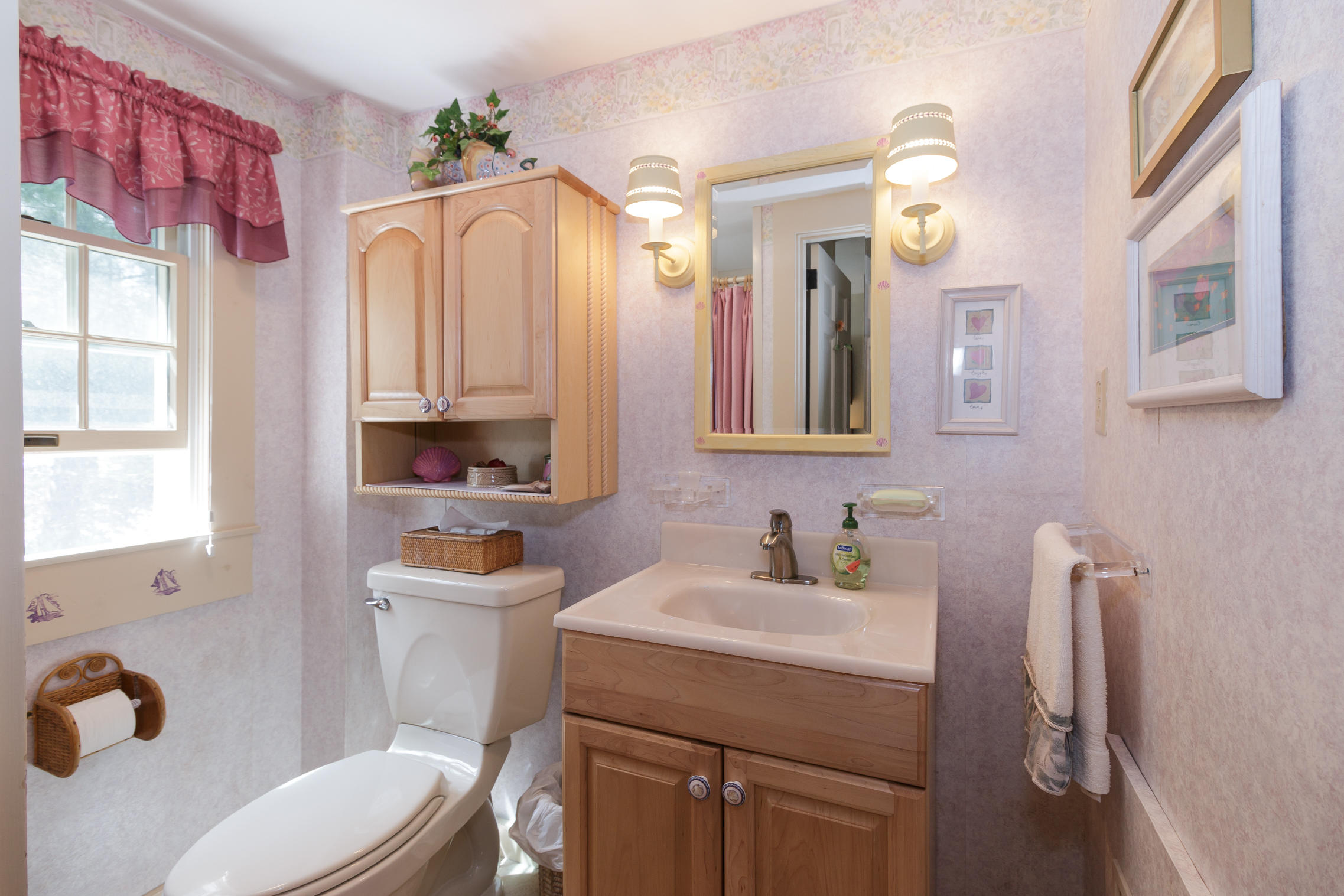 75 Harbor Bluff Road Hyannis, MA 02601 - Photo 13 of 31 a bathroom with a toilet sink and mirror