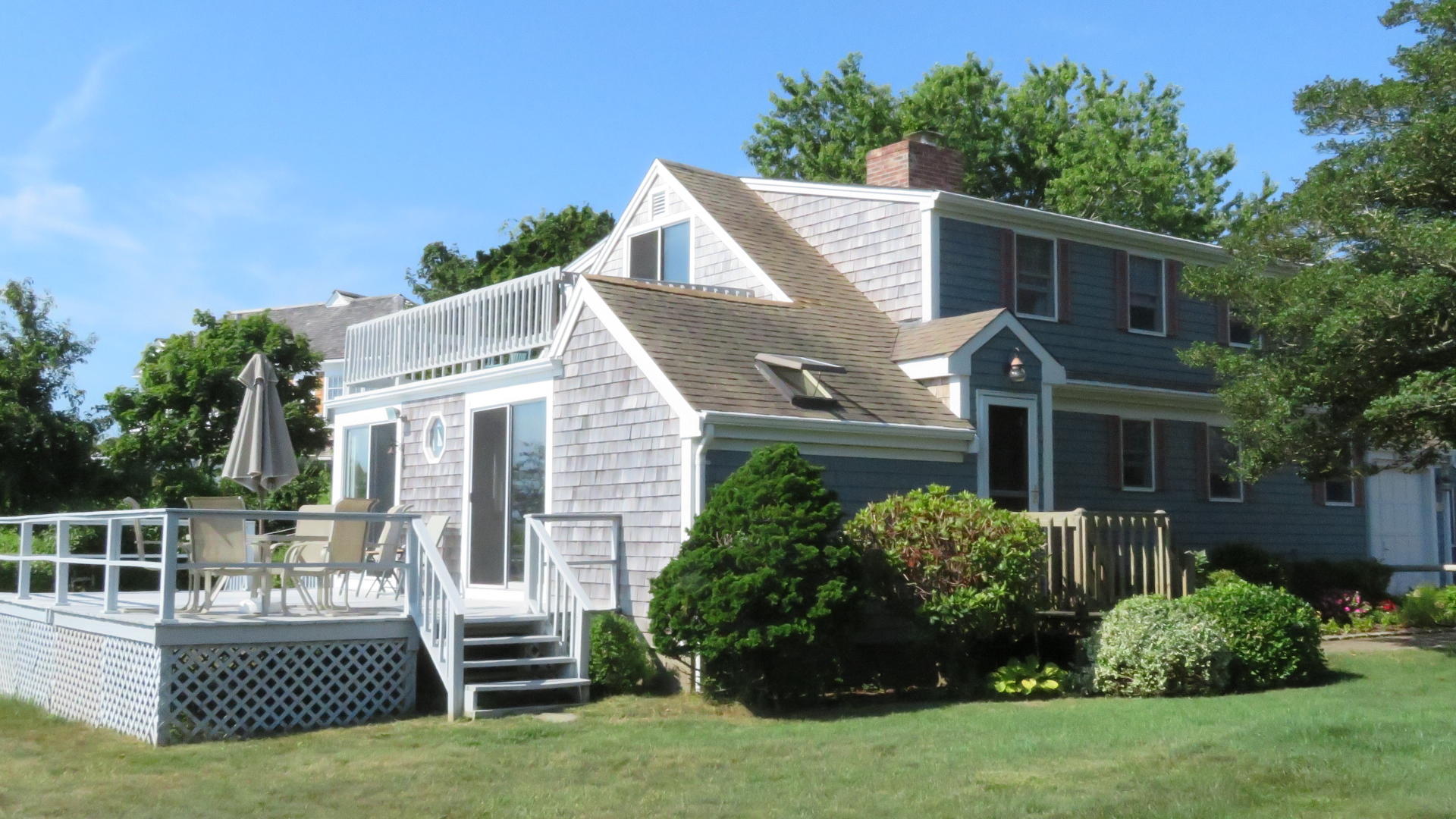 75 Harbor Bluff Road Hyannis, MA 02601 - Photo 2 of 31 front view of a house with a yard