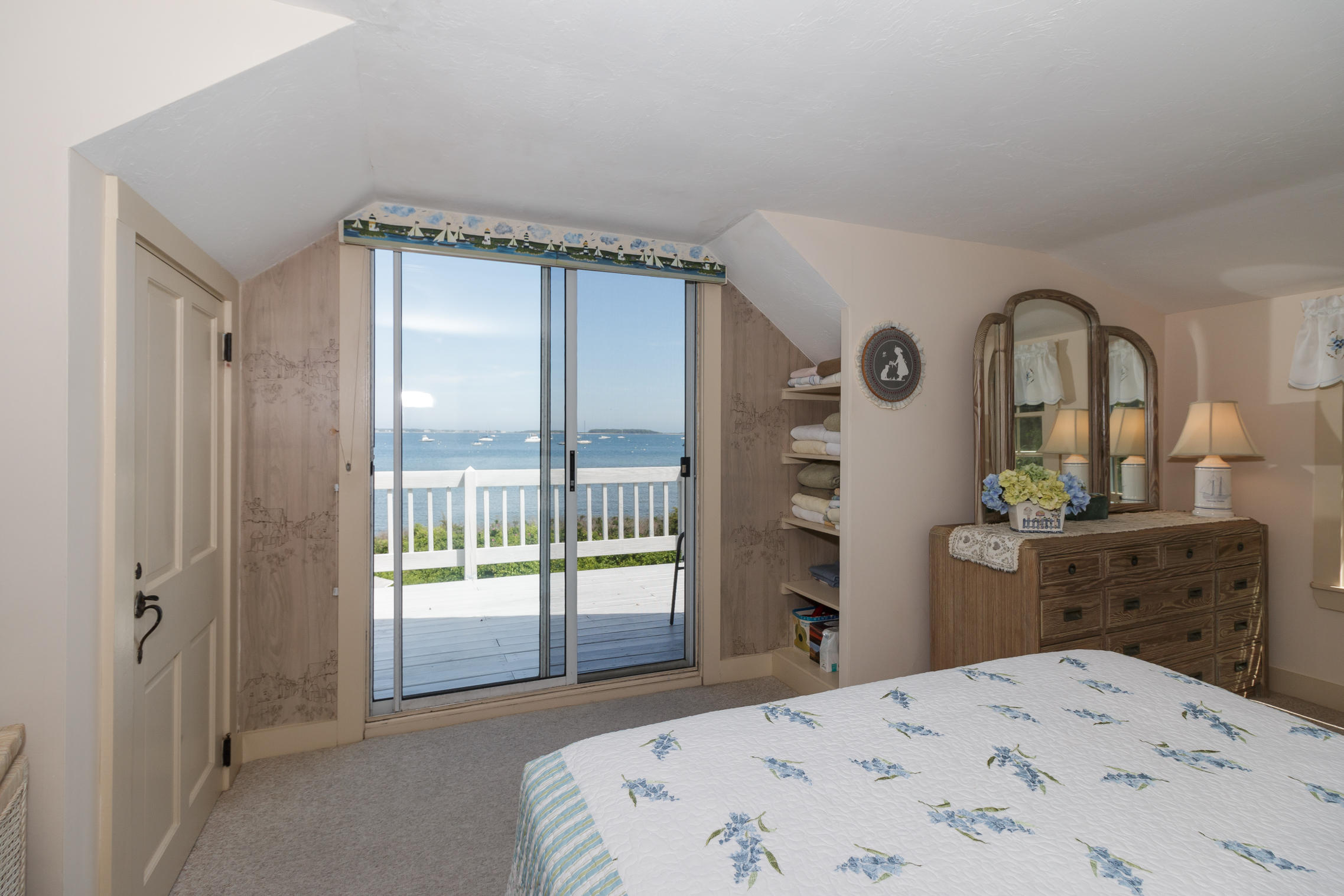 75 Harbor Bluff Road Hyannis, MA 02601 - Photo 21 of 31 a bedroom with a bed and a dresser