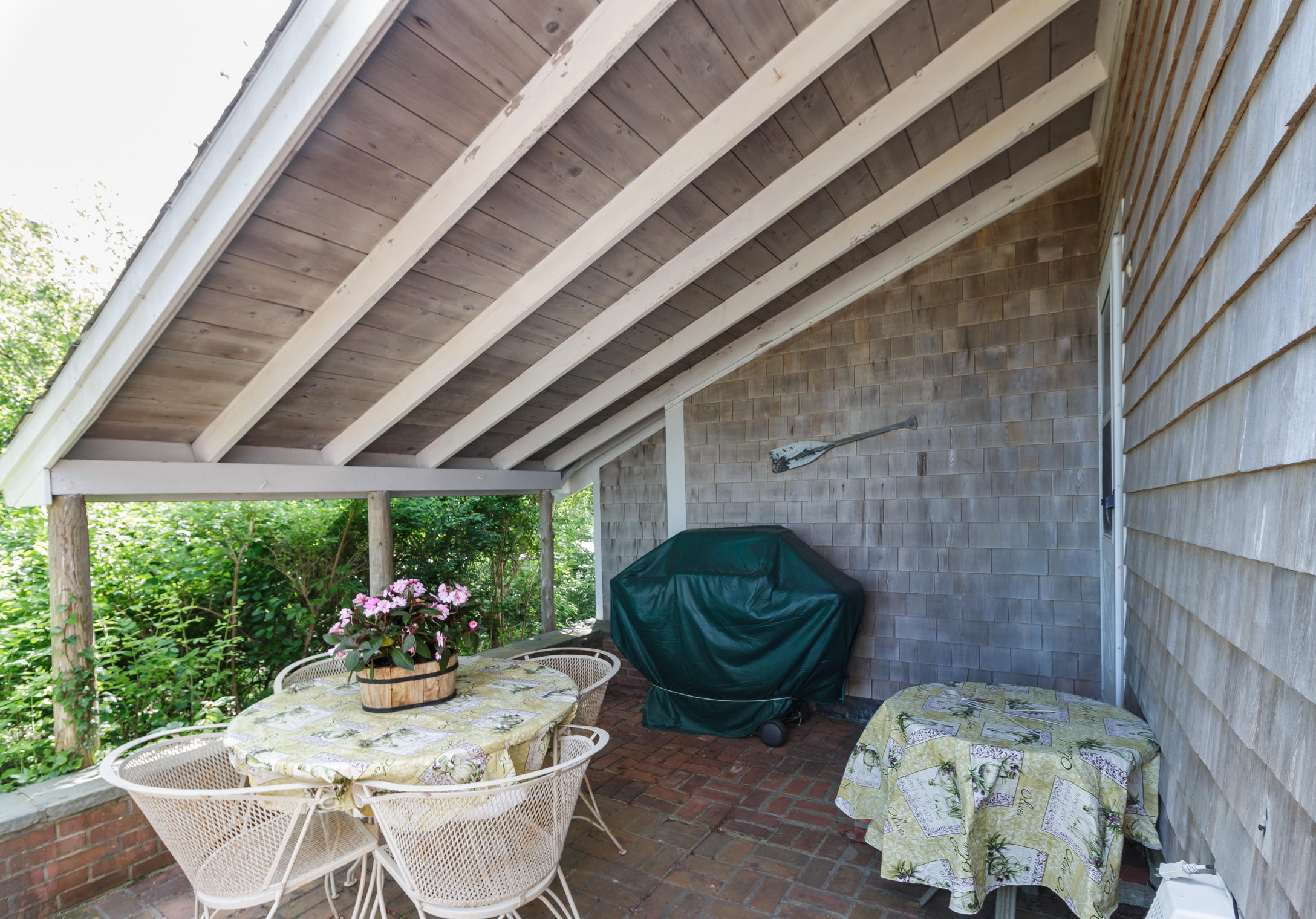 75 Harbor Bluff Road Hyannis, MA 02601 - Photo 26 of 31 a view of a chairs and table in backyard