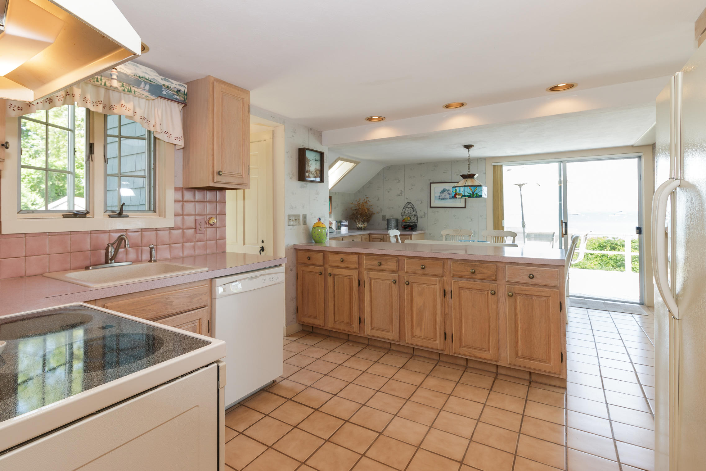 75 Harbor Bluff Road Hyannis, MA 02601 - Photo 6 of 31 a kitchen with a sink cabinets and window