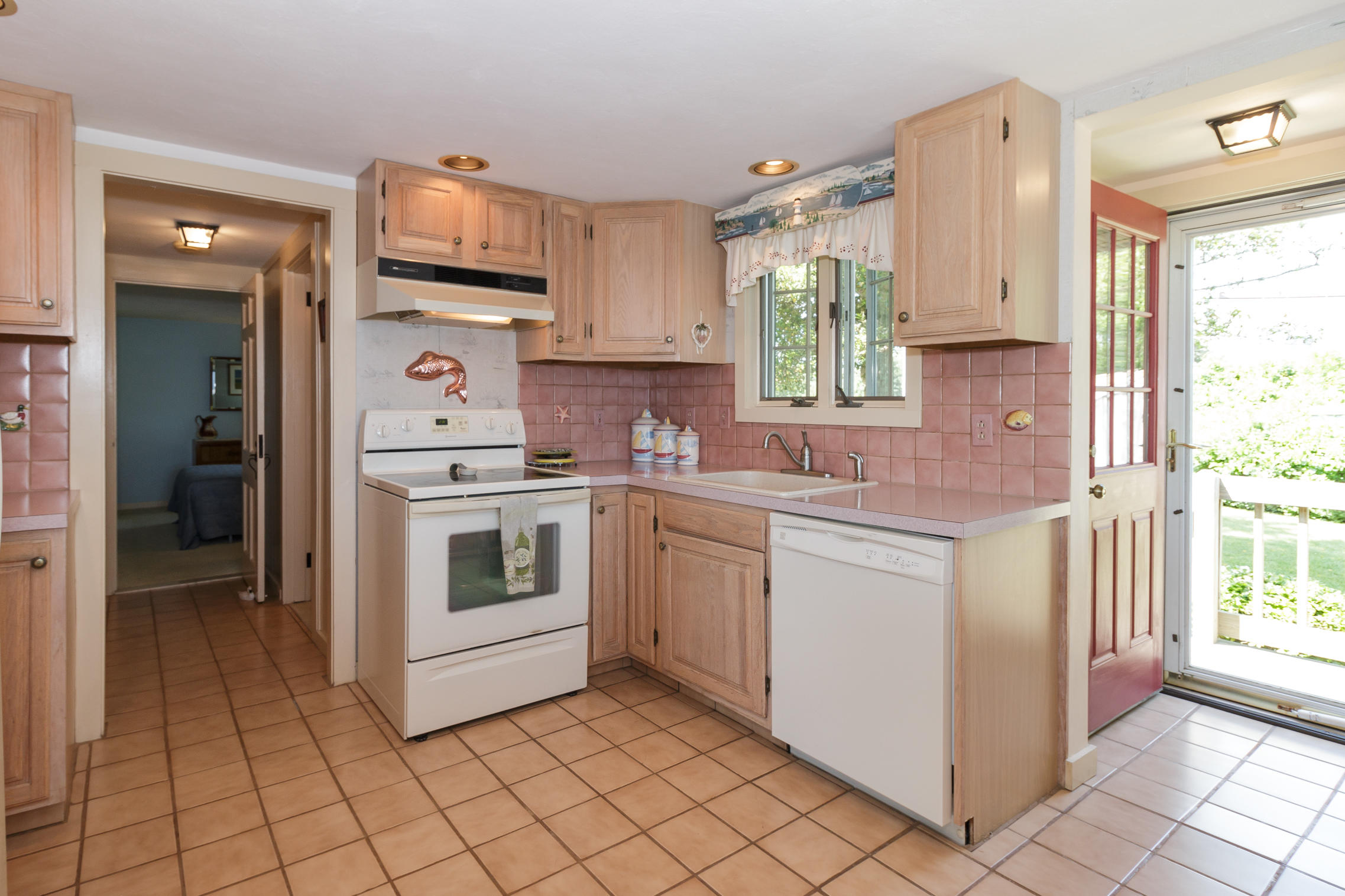 75 Harbor Bluff Road Hyannis, MA 02601 - Photo 7 of 31 a kitchen with a stove a sink and a refrigerator