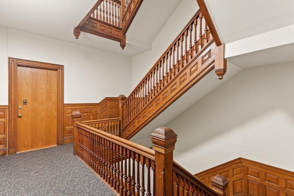 473 Beacon Street, Unit 5 Boston, MA 02115 - Photo 16 of 21 a view of staircase with wooden floor and stairs