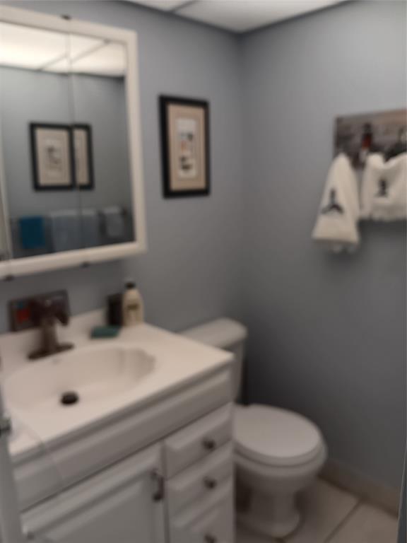 503 Saxony Drive, Unit 503 Delray Beach, FL 33446 - Photo 14 of 21 a white toilet sitting next to a bathroom sink
