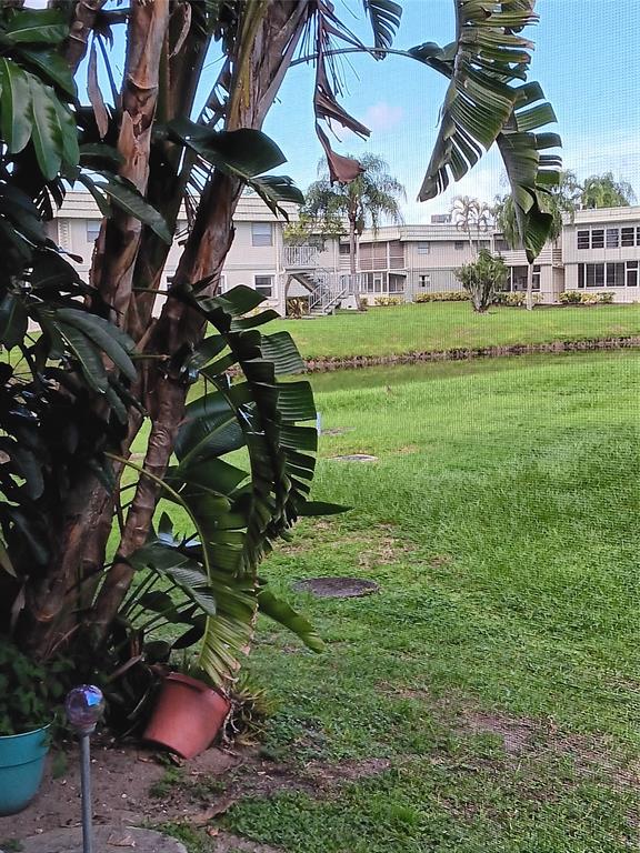 503 Saxony Drive, Unit 503 Delray Beach, FL 33446 - Photo 17 of 21 a view of a house with a backyard