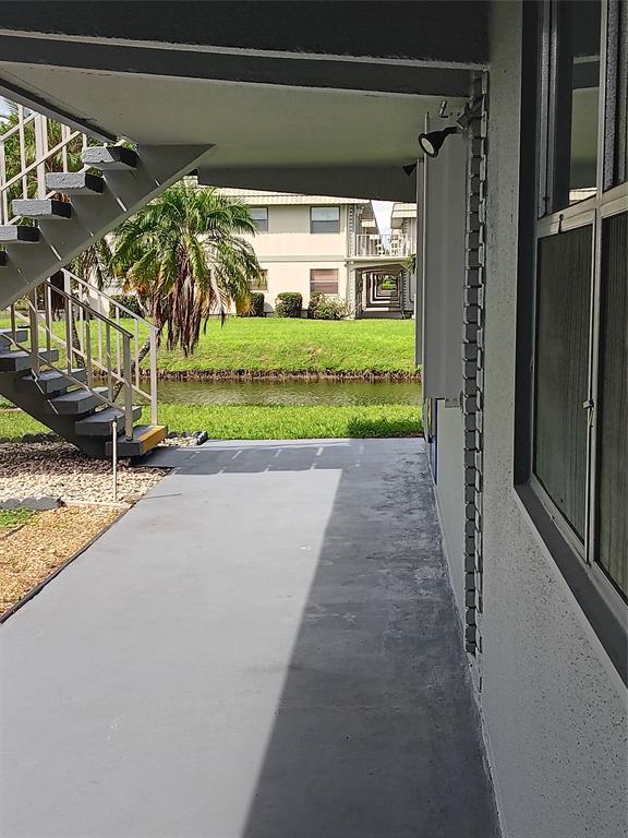 503 Saxony Drive, Unit 503 Delray Beach, FL 33446 - Photo 20 of 21 a view of swimming pool with a yard