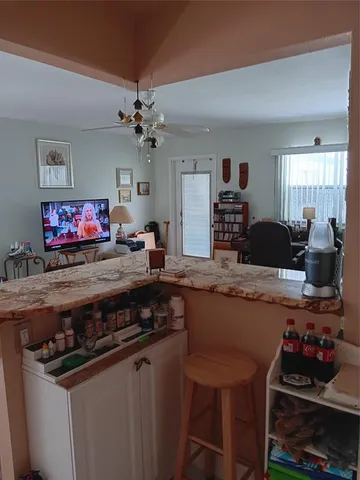 a kitchen with stainless steel appliances a stove a sink and a refrigerator