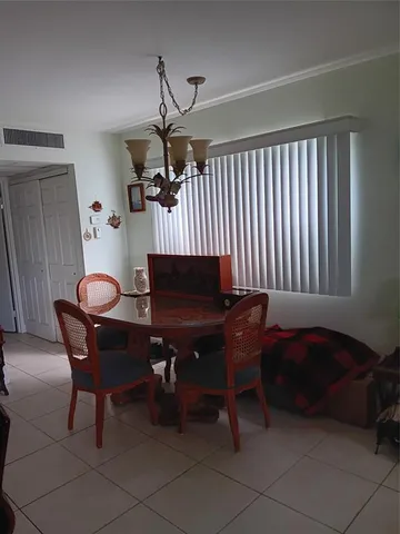 a living room with furniture a table and a window
