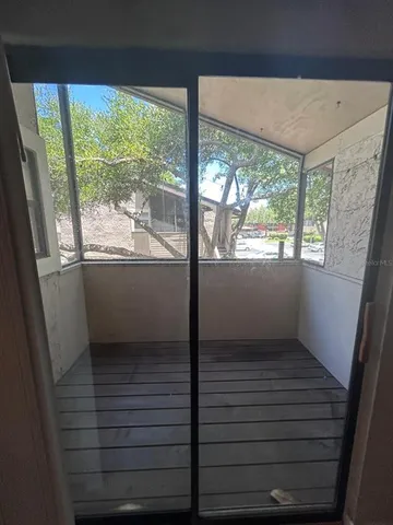 a view of empty room with windows