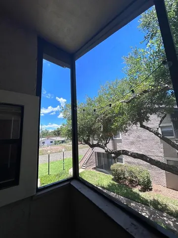 a view of a porch and a yard