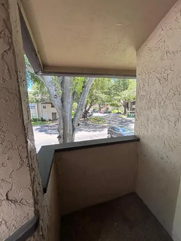 a view of balcony and backyard