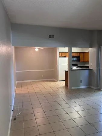 a view of a kitchen with a sink and a microwave