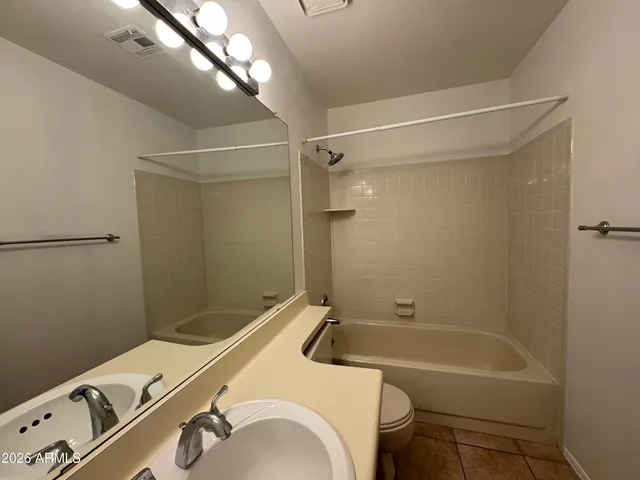a bathroom with a sink and a bathtub