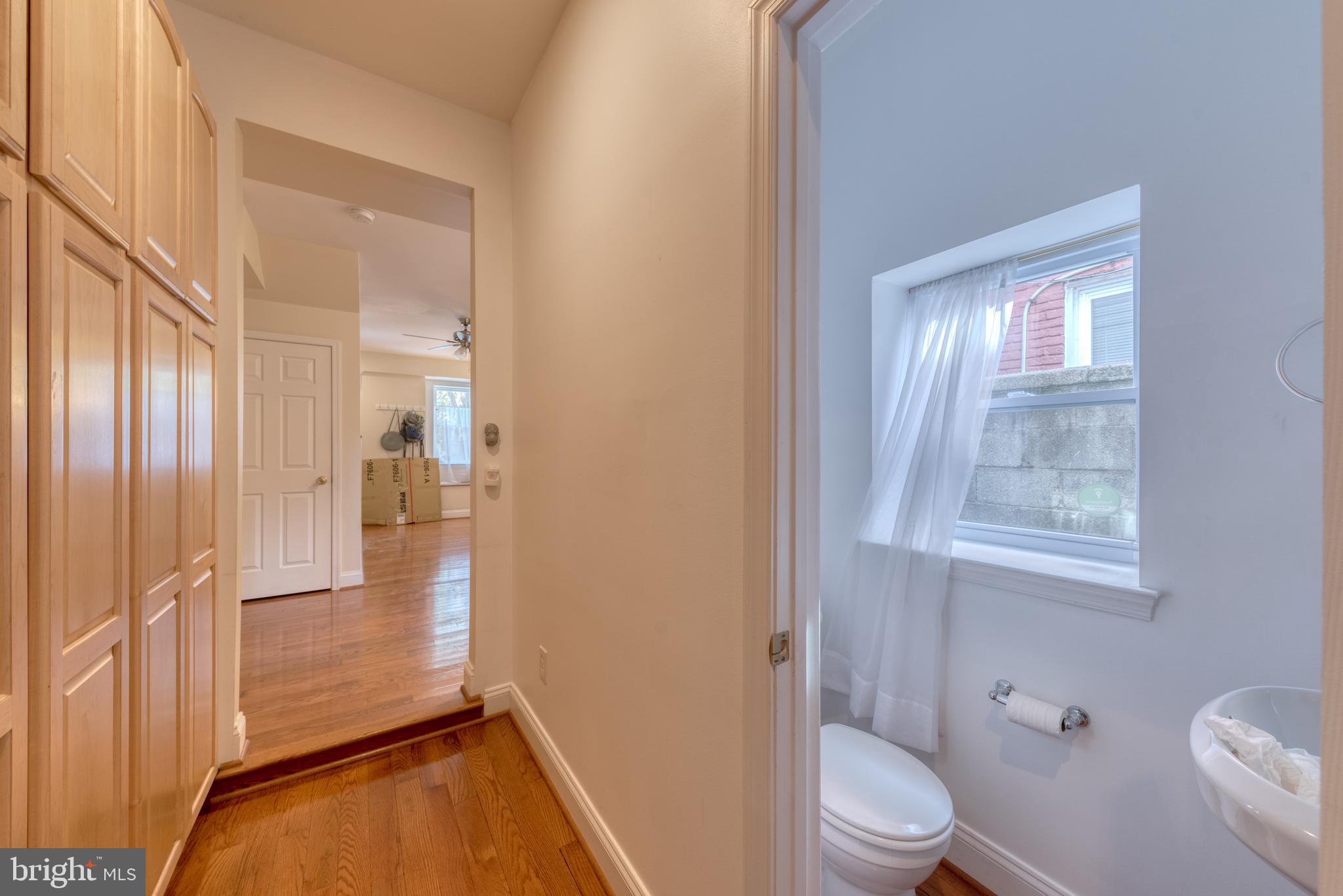 1818 Bank Street Baltimore, MD 21231 - Photo 10 of 20 a bathroom with a toilet tub and a shower