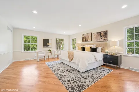 a bedroom with a large bed and a couch