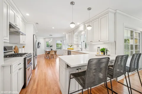 a view of kitchen with cabinets and wooden floor