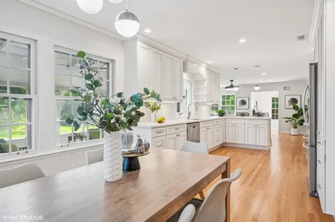 a kitchen with a table and chairs