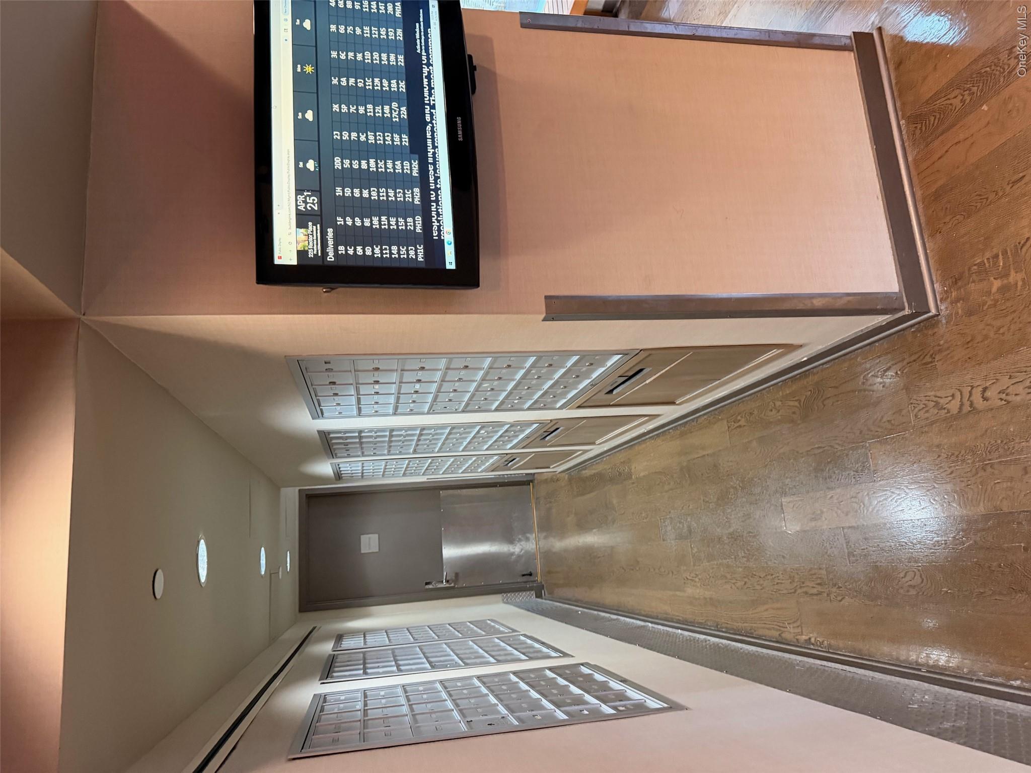 225 Rector Place, Unit 7E Manhattan, NY 10280 - Photo 17 of 19 Hallway featuring wood-finish flooring, recessed lighting, and wall-mounted mailboxes