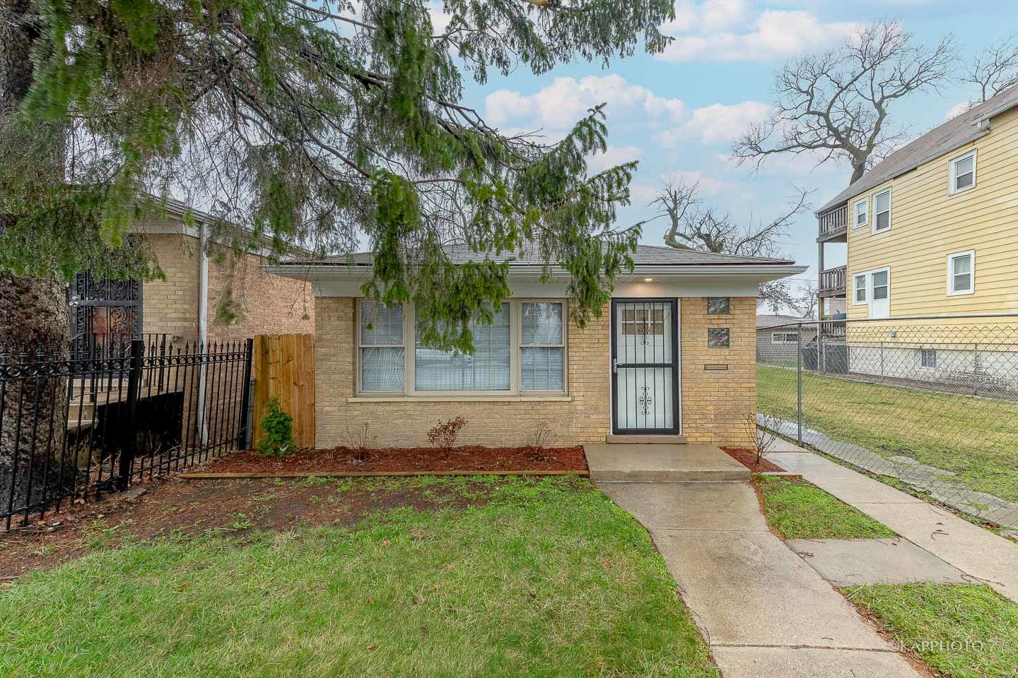 5654 South Princeton Avenue Chicago, IL 60621 - Photo 1 of 29 a front view of a house with garden