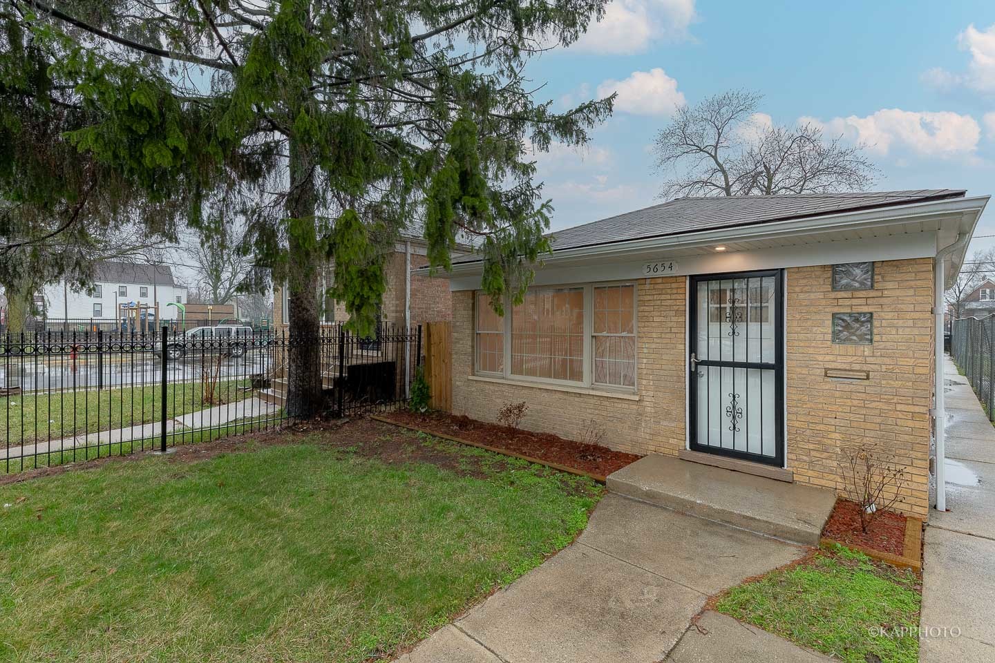 5654 South Princeton Avenue Chicago, IL 60621 - Photo 2 of 29 front view of a house with a yard