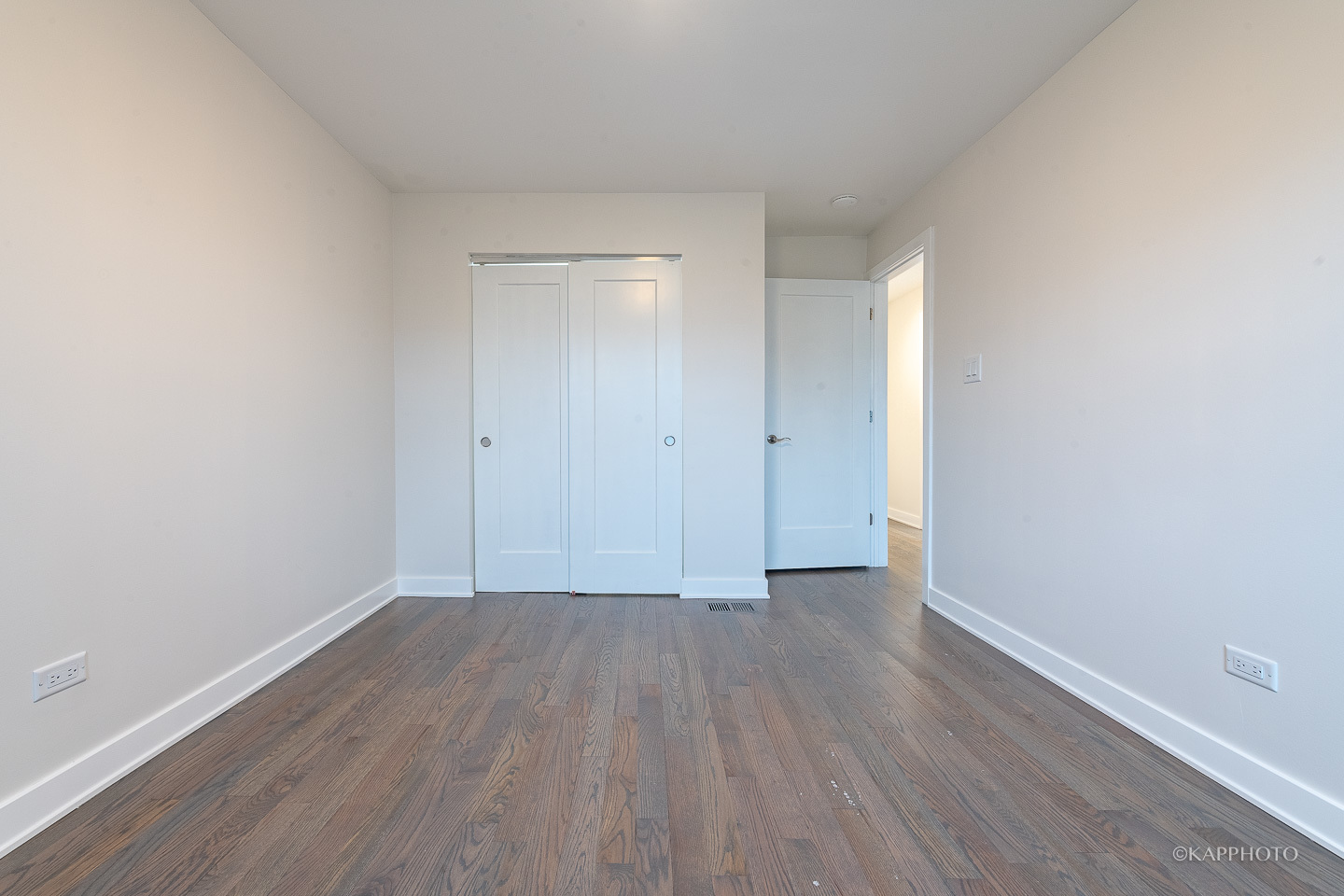 5654 South Princeton Avenue Chicago, IL 60621 - Photo 21 of 29 a view of an empty room with wooden floor