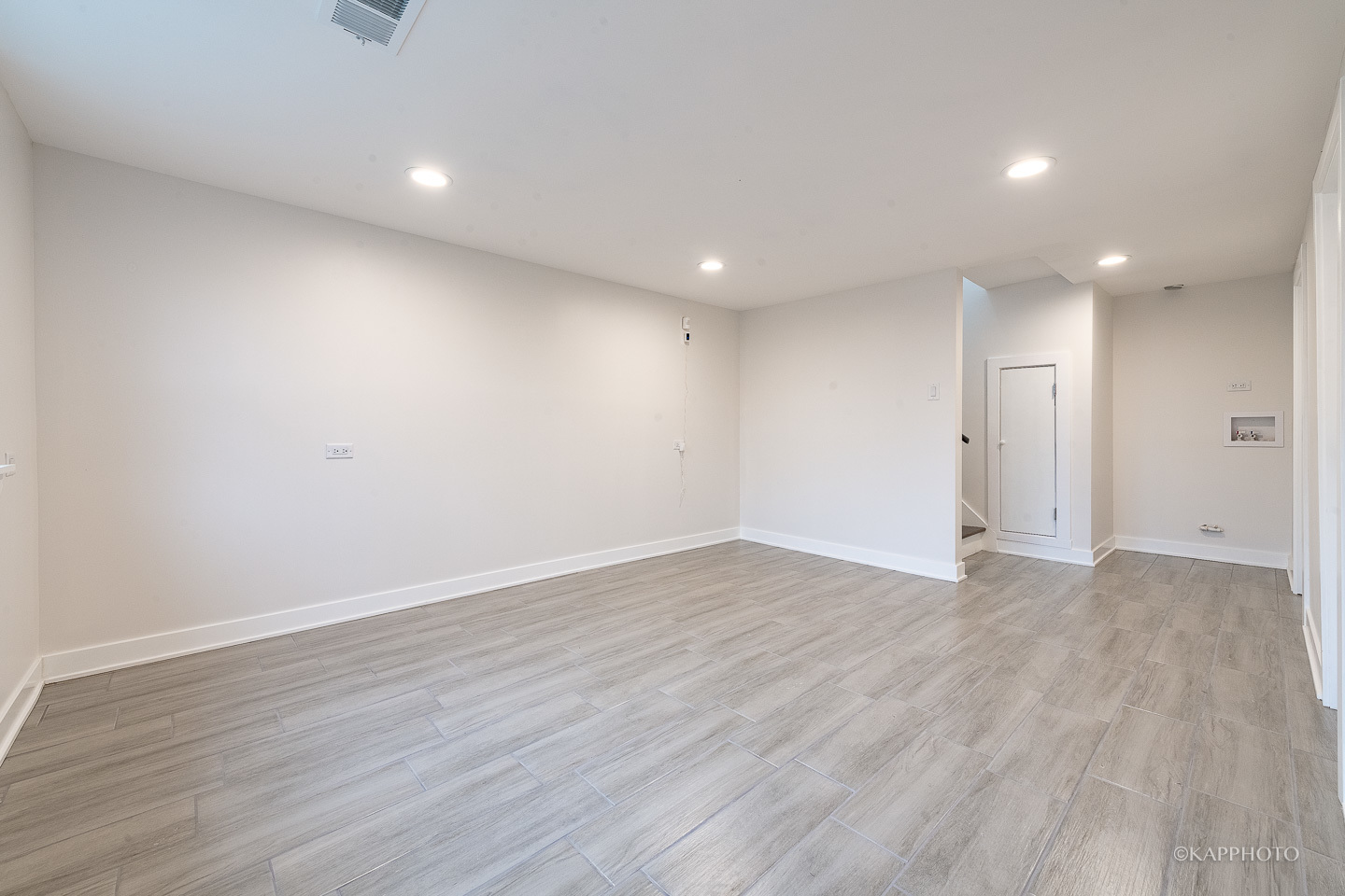 5654 South Princeton Avenue Chicago, IL 60621 - Photo 27 of 29 a view of an empty room with wooden floor